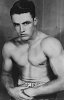 Wrestler_Stu_Hart_wearing_an_amateur_wrestling_championship_belt,_sometime_between_1933_and_1936.jpg